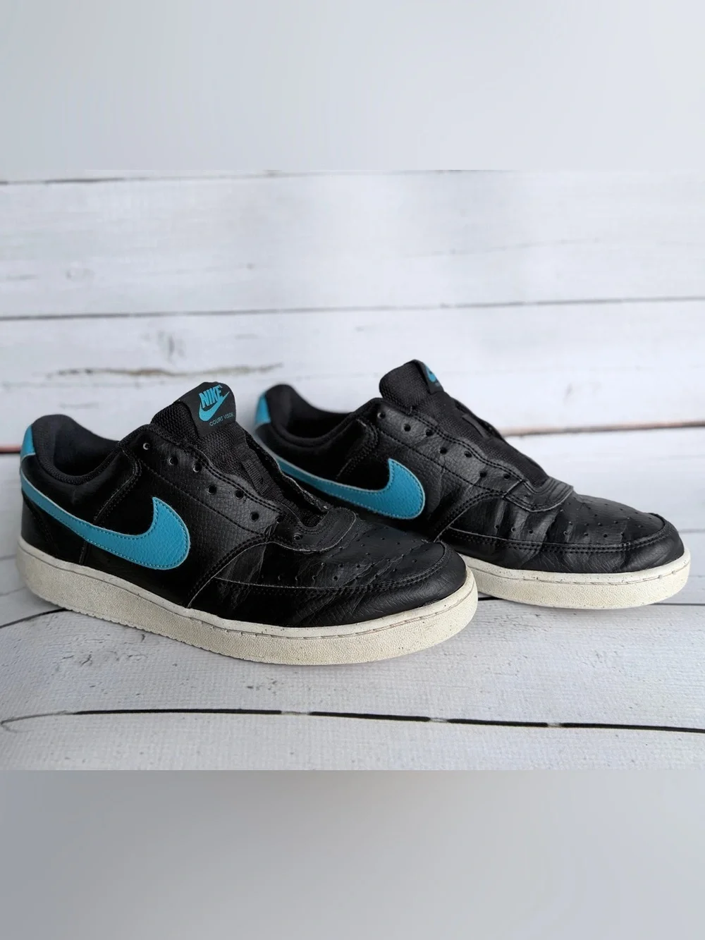 Nike Men’s Black Sneakers with Blue Swoosh